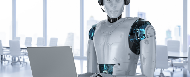 Ein Roboter sitzt vor einem Laptop